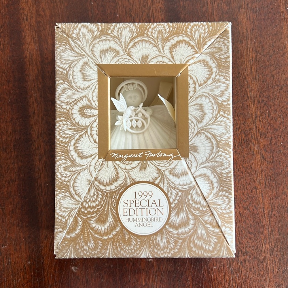 1999 special education hummingbird angel ornament. Brand new still in box!
